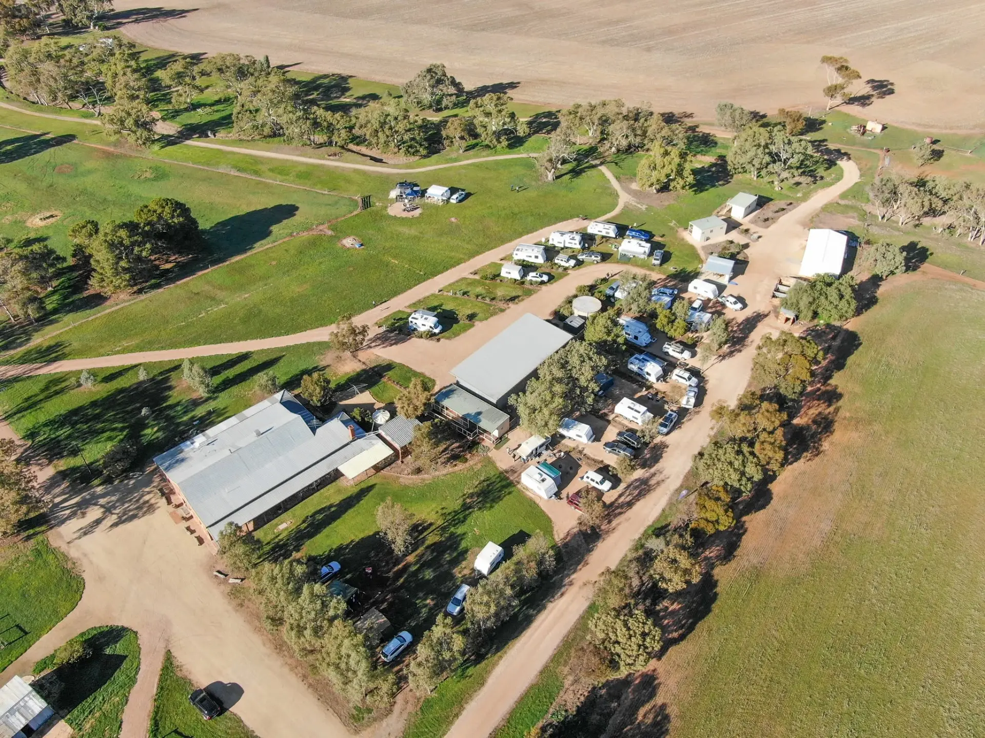 Aerial view across the park towards the shearing shed